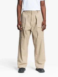 Le pantalon mixte ample Aigle Experience by Études - Beige